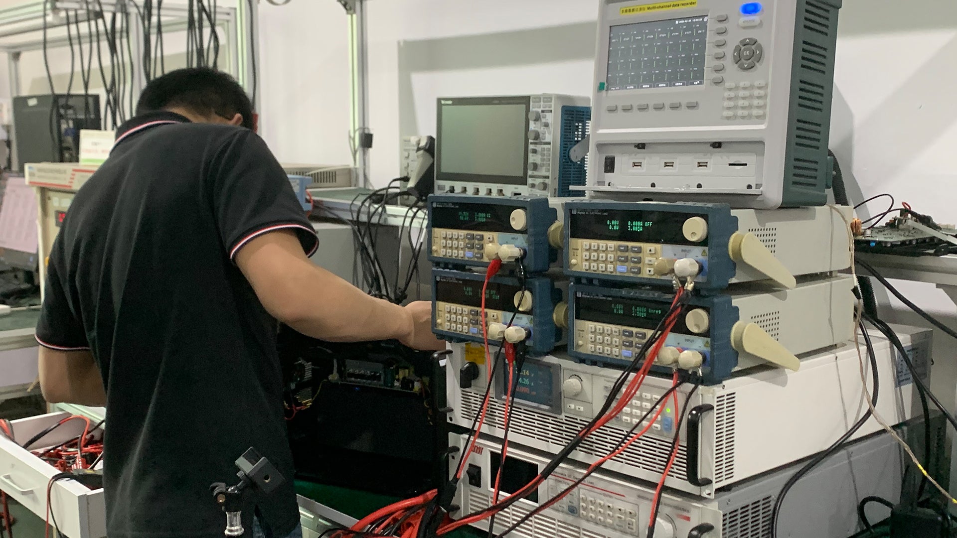 WEGREEN R&D laboratory showing engineers working on industrial power systems, representing professional-grade reliability for long-term operations